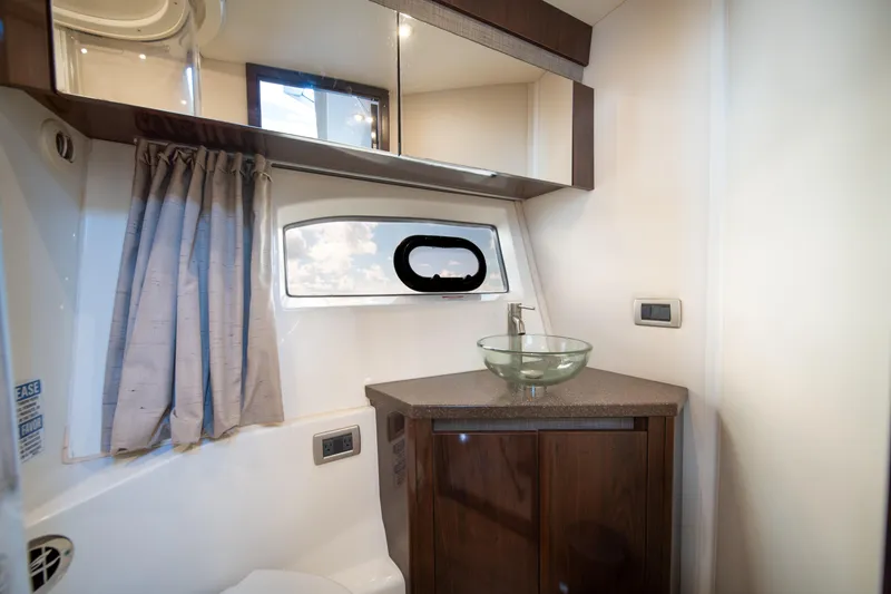 Slide: The Image of Luxurious bathroom interior of 2016 Sea Ray 400 Sundancer yacht with modern fixtures. - 32