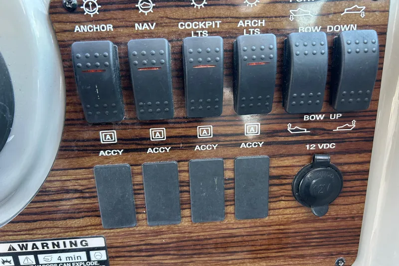 Slide: The Image of Control panel of a 2011 Bayliner 285 Cruiser with switches and 12V socket. - 10