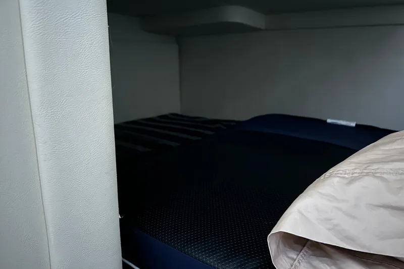 Slide: The Image of Interior cabin of 2011 Bayliner 285 Cruiser with cozy bedding. - 22