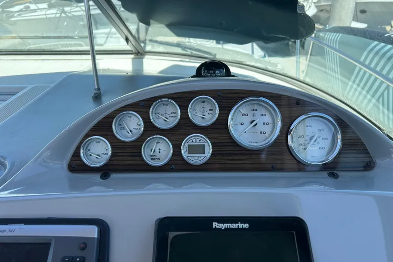 Slide: The Image of Dashboard of 2011 Bayliner 285 Cruiser with gauges and Raymarine display. - 7