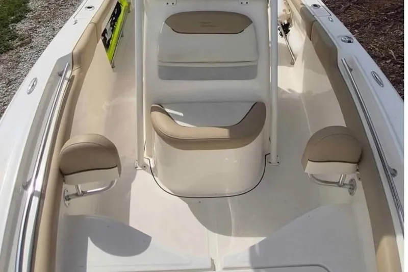 Slide: The Image of 2019 Pioneer 202 Islander boat interior with beige seating and white deck. - 5