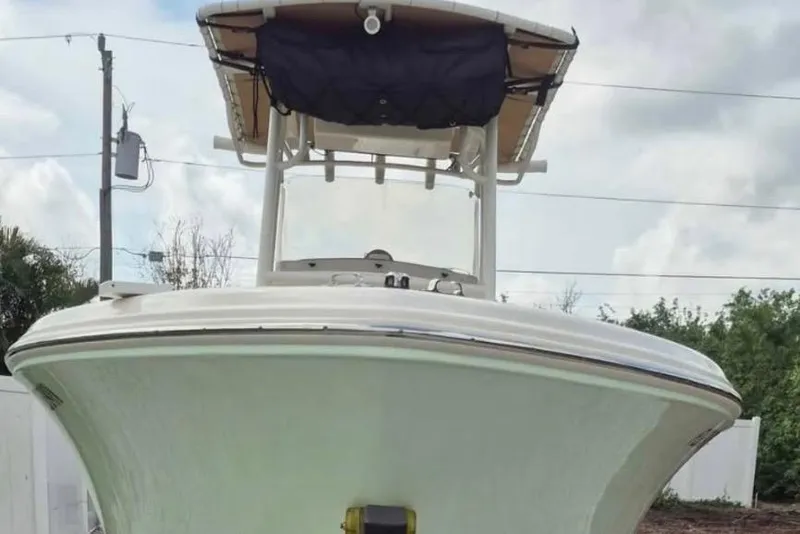 Slide: The Image of 2019 Pioneer 202 Islander boat, front view, with canopy, outdoors. - 6