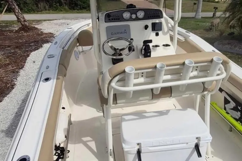 Slide: The Image of 2019 Pioneer 202 Islander boat interior with Garmin system and rod holders. - 9