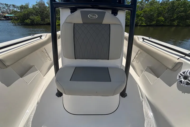 Slide: The Image of 2026 Key West 239 FS boat interior with cushioned seating and sleek design. - 16
