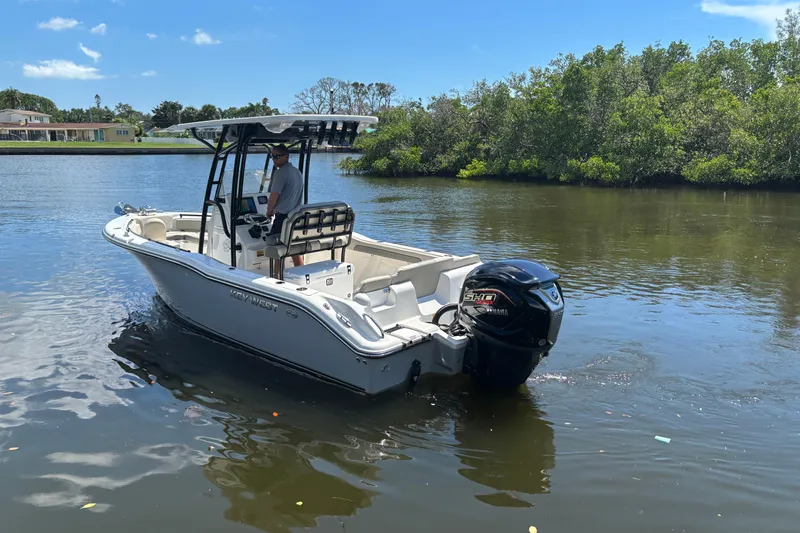 Slide: The Image of 2026 Key West 239 FS boat on calm water, surrounded by lush greenery. - 4