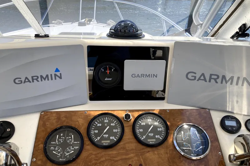 Slide: The Image of Boat dashboard with Garmin displays and gauges, Albemarle 28 Express, 2002 model. - 14