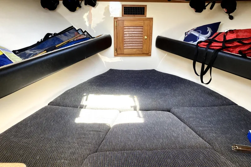 Slide: The Image of Interior cabin of a 2002 Albemarle 28 Express boat with cushioned seating. - 3