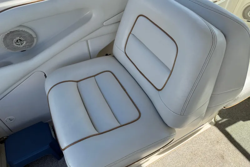 Slide: The Image of White leather seat on 1998 Sea Ray 280 Sun Sport boat interior. - 11