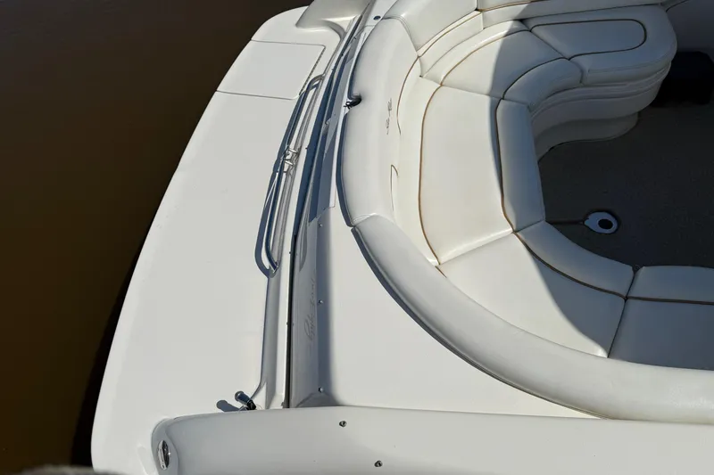 Slide: The Image of 1998 Sea Ray 280 Sun Sport boat with white cushioned seating and sleek design. - 3