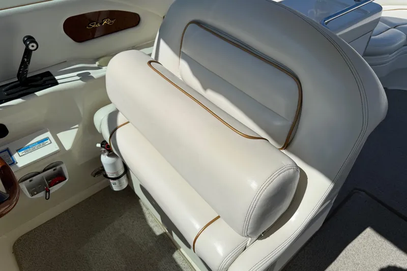 Slide: The Image of 1998 Sea Ray 280 Sun Sport boat interior with white leather seating and control panel. - 7