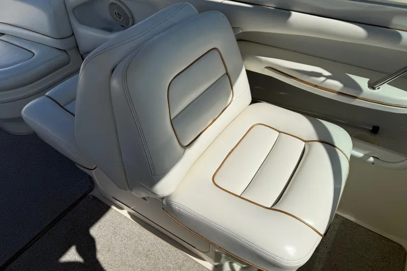 Slide: The Image of White leather seat on 1998 Sea Ray 280 Sun Sport boat interior. - 9