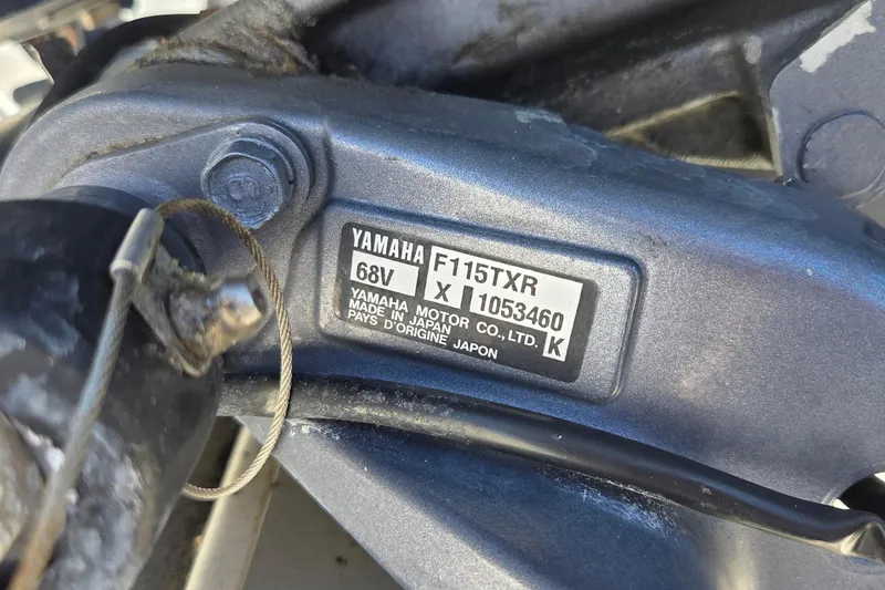 Slide: The Image of Close-up of Yamaha F115TXR engine label on 2006 NauticStar 1900 Nautic Bay boat. - 14