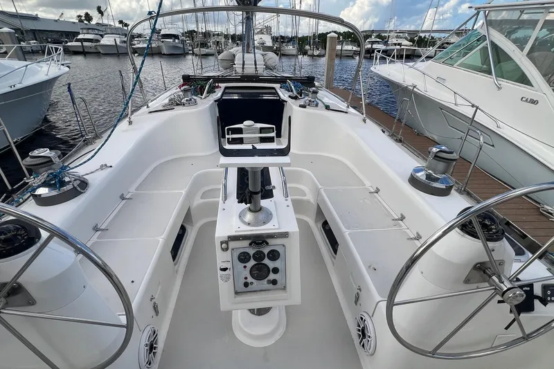 Slide: The Image of Cockpit of a 1999 Catalina 470 sailboat docked at a marina. - 11
