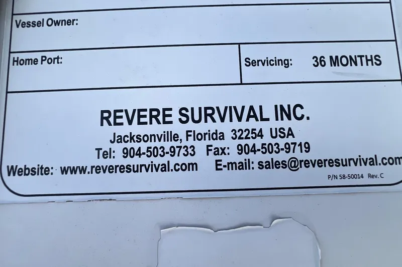 Slide: The Image of Revere Survival Inc. contact label on Catalina 470, 1999 model, Jacksonville, Florida. - 16