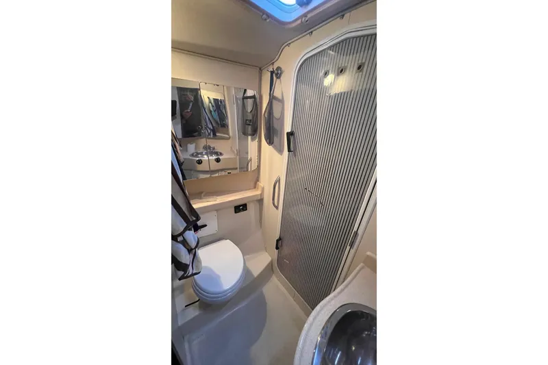 Slide: The Image of Bathroom interior of 1999 Catalina 470 yacht with shower, toilet, and sink. - 34