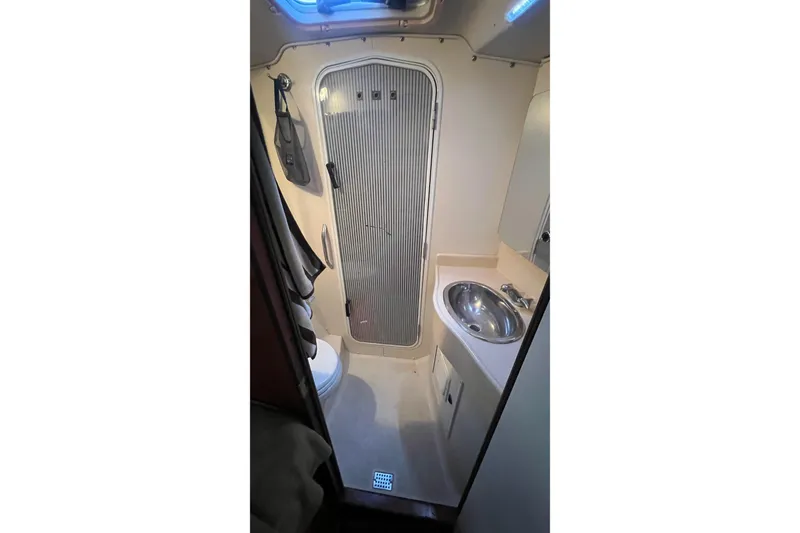 Slide: The Image of Bathroom interior of 1999 Catalina 470 yacht with sink, toilet, and shower. - 35