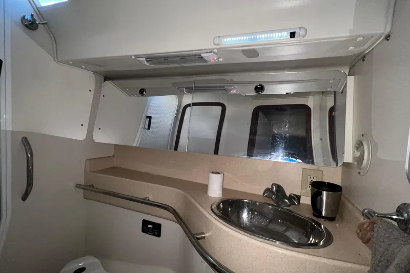 Slide: The Image of Interior of 1999 Catalina 470 yacht bathroom with sink, mirror, and countertop. - 38