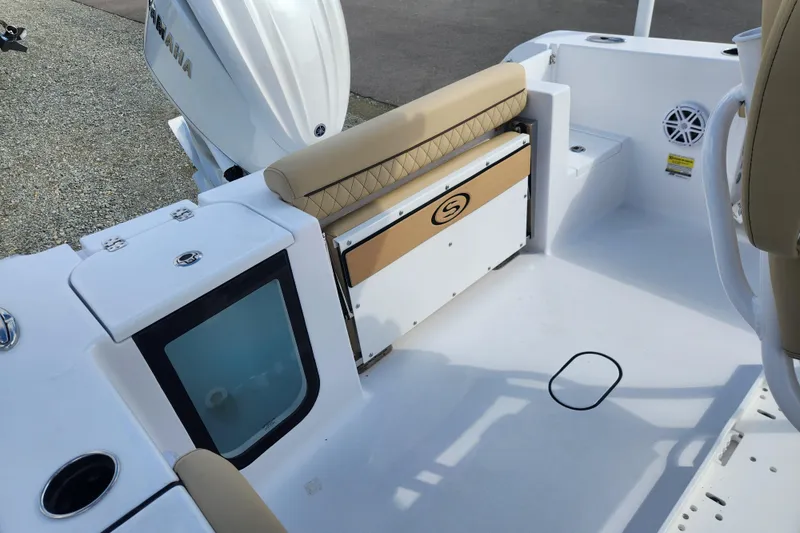 Slide: The Image of 2026 Sportsman Open 232 Center Console boat interior with seating and storage. - 11