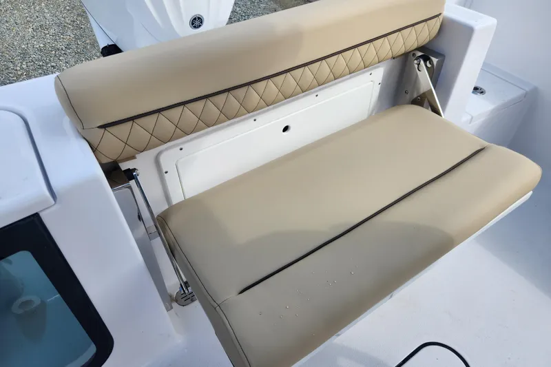 Slide: The Image of Beige cushioned seating on 2026 Sportsman Open 232 Center Console boat. - 12