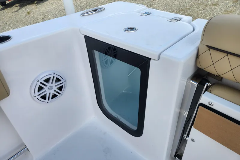 Slide: The Image of 2026 Sportsman Open 232 Center Console interior with speaker and storage compartment. - 13
