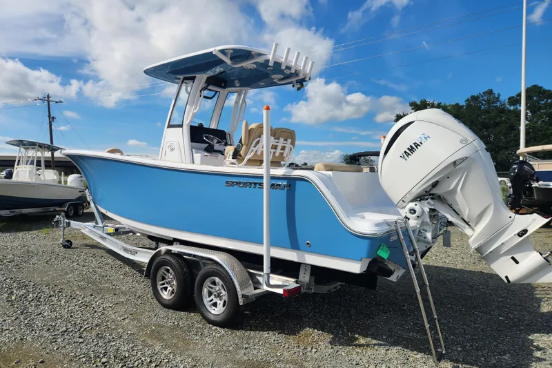 Slide: The Image of 2026 Sportsman Open 232 Center Console boat with Yamaha engine on trailer. - 4