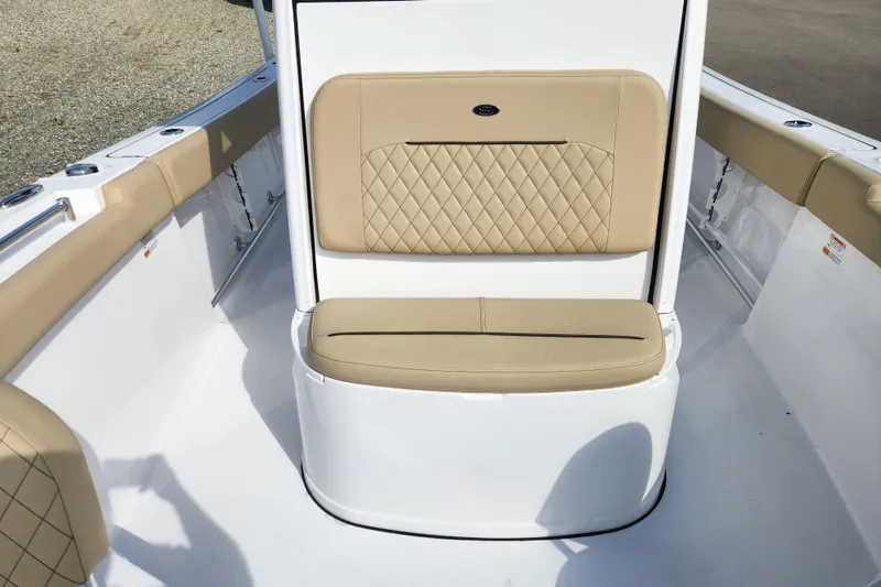 Slide: The Image of 2026 Sportsman Open 232 Center Console boat with tan cushioned seating. - 8