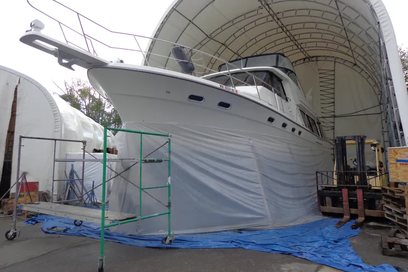 Slide: The Image of 1999 Bayliner 4788 Pilot House Motoryacht under maintenance in covered storage. - 5