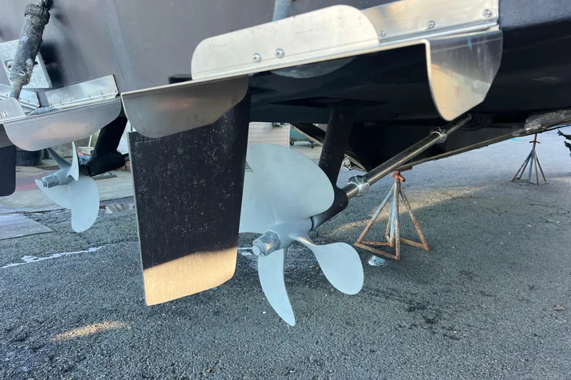 Slide: The Image of 1999 Bayliner 4788 Pilot House Motoryacht propeller and rudder detail on dry dock. - 9