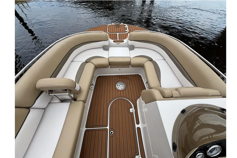 Slide: The Image of 2017 Starcraft Star Step 221 I/O boat interior with tan and white seating, wooden deck. - 2