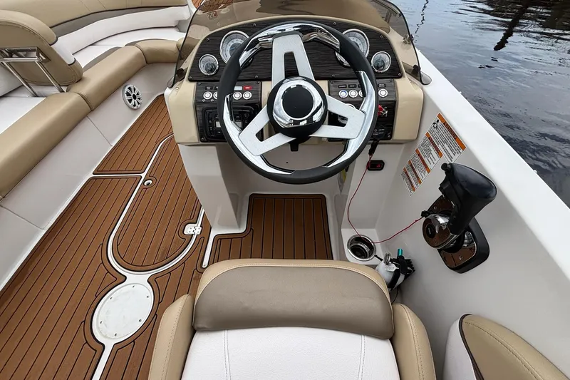 Slide: The Image of 2017 Starcraft Star Step 221 I/O boat interior with steering wheel and seating. - 23