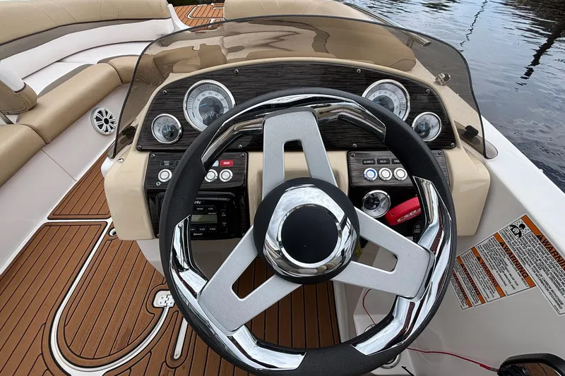 Slide: The Image of Steering wheel and dashboard of 2017 Starcraft Star Step 221 I/O boat. - 24