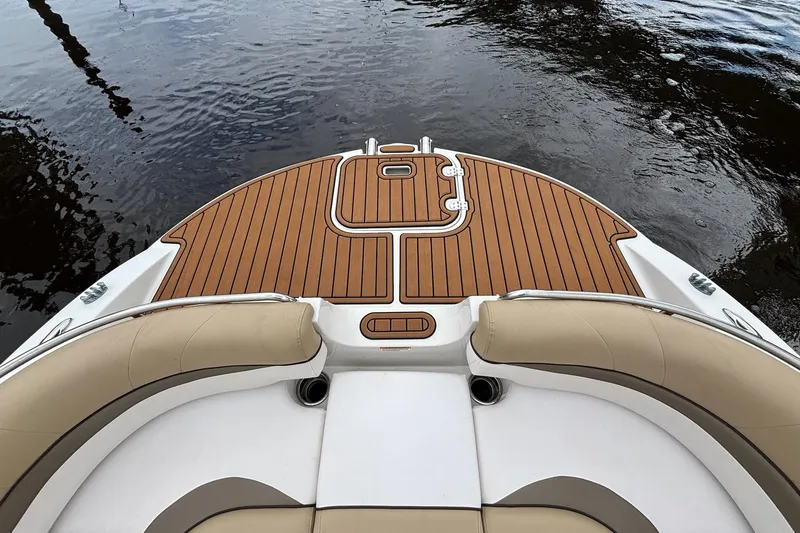 Slide: The Image of 2017 Starcraft Star Step 221 I/O boat with teak deck and beige seating. - 6