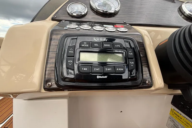 Slide: The Image of Dashboard of 2017 Starcraft Star Step 221 I/O with Infinity Bluetooth stereo system. - 8