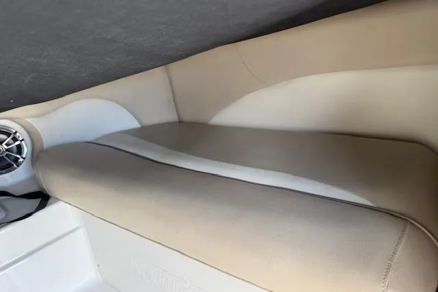 Slide: The Image of 2017 NauticStar 203DC Sport Deck boat interior seating with beige upholstery. - 14