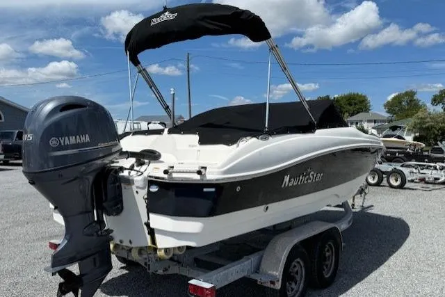 Slide: The Image of 2017 NauticStar 203DC Sport Deck boat on trailer with Yamaha outboard motor. - 4