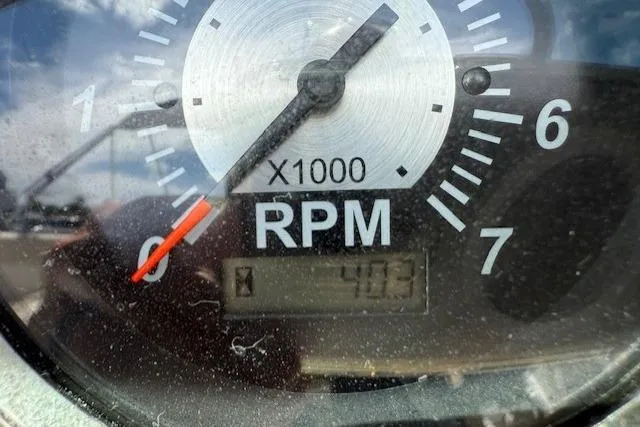 Slide: The Image of Close-up of 2017 NauticStar 203DC Sport Deck RPM gauge showing 403 RPM. - 7