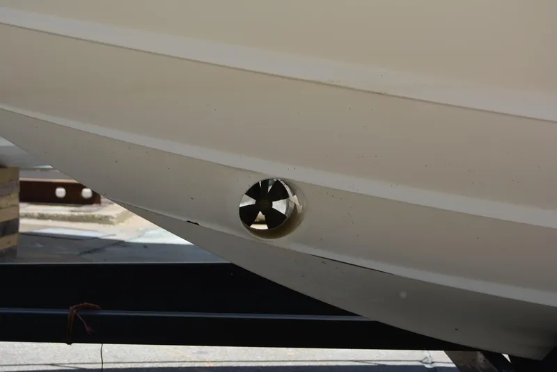 Slide: The Image of Bow thruster on a 2004 Sea Ray 300 Sundancer boat hull. - 15