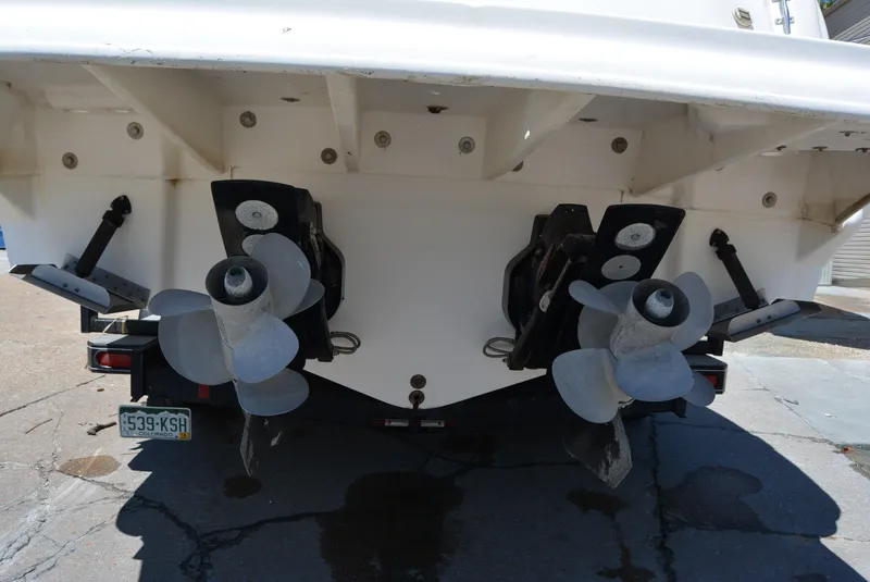 Slide: The Image of Rear view of 2004 Sea Ray 300 Sundancer boat with dual propellers. - 19