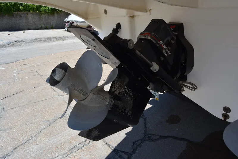 Slide: The Image of 2004 Sea Ray 300 Sundancer boat propeller and stern drive detail. - 25