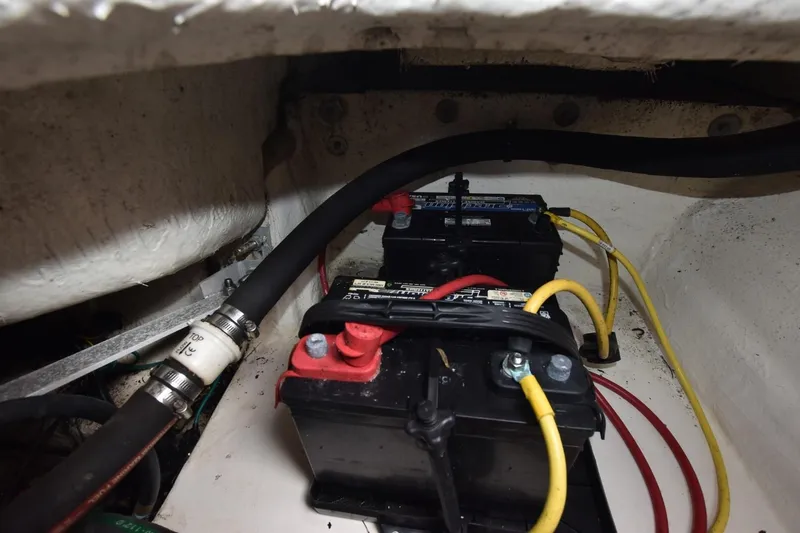 Slide: The Image of Batteries and wiring inside 2018 Chaparral 230 Suncoast boat compartment. - 20