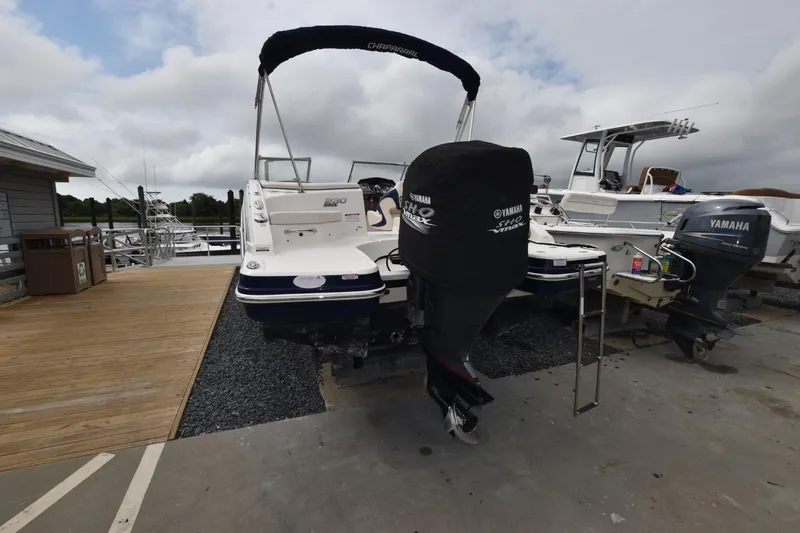 Slide: The Image of 2018 Chaparral 230 Suncoast boat with Yamaha engine at dockside. - 3