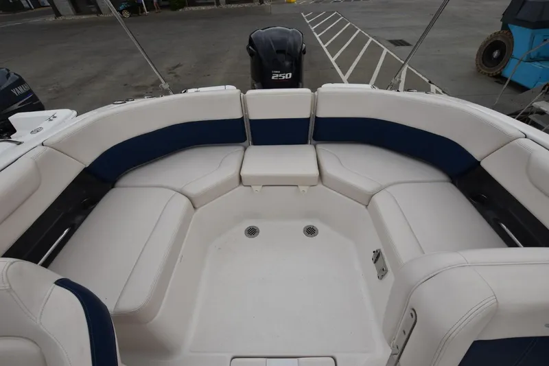 Slide: The Image of 2018 Chaparral 230 Suncoast boat interior with white and blue seating. - 5