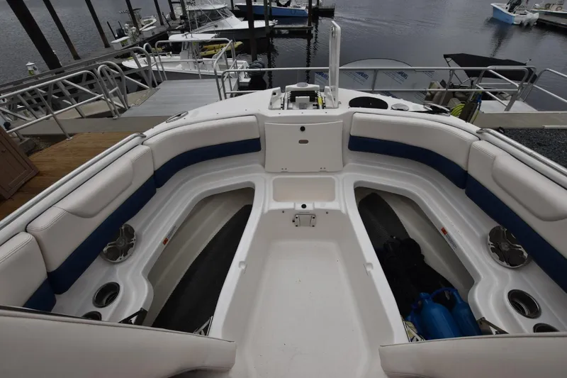 Slide: The Image of 2018 Chaparral 230 Suncoast boat interior with spacious seating at dock. - 7