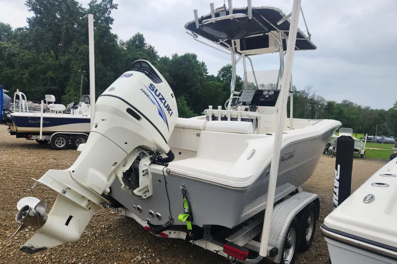 Slide: The Image of 2016 Bulls Bay 200 Center Console boat with Suzuki outboard motor on trailer. - 1