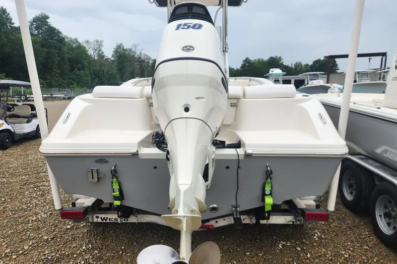Slide: The Image of 2016 Bulls Bay 200 Center Console boat with outboard motor, parked on a trailer. - 2