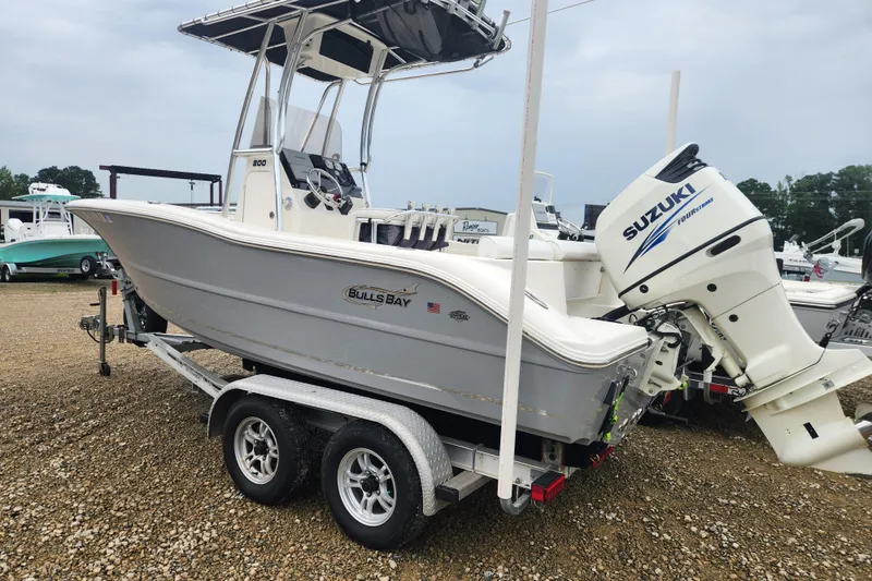 Slide: The Image of 2016 Bulls Bay 200 Center Console boat on trailer with Suzuki outboard motor. - 3