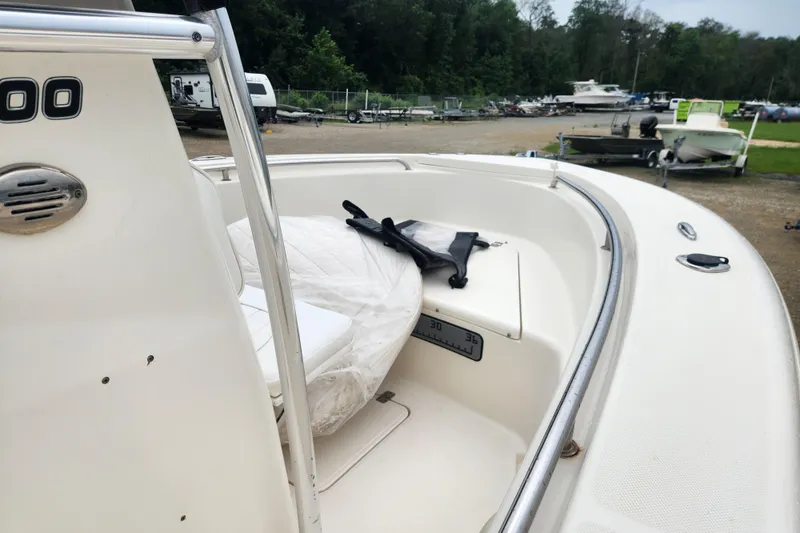 Slide: The Image of 2016 Bulls Bay 200 Center Console boat, white interior, parked outdoors. - 8