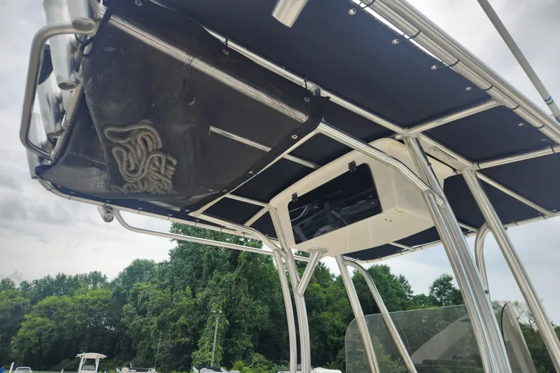 Slide: The Image of 2016 Bulls Bay 200 Center Console boat with T-top and storage net. - 9