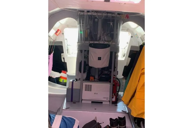 Slide: The Image of Interior of 2009 Class 40 Akilaria RC2 sailboat with equipment and clothing. - 14