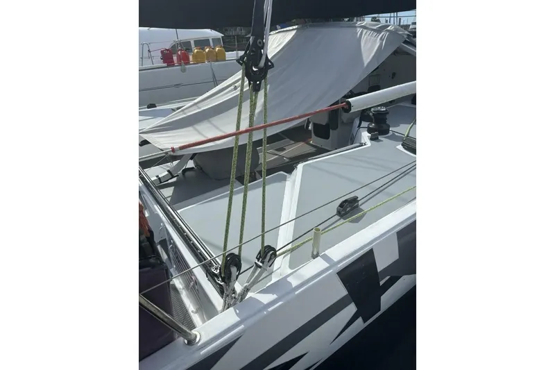 Slide: The Image of 2009 Class 40 Akilaria RC2 sailboat deck with rigging and sunshade. - 22